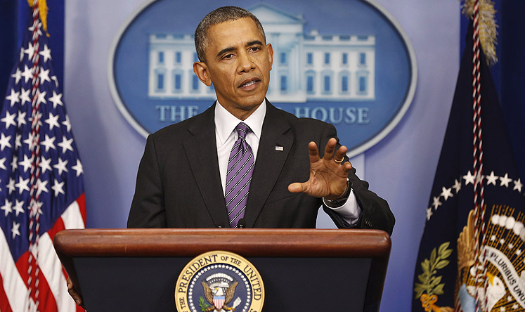 The US president briefs the press at the White House on progress implementing Obamacare. Photo: Reuters