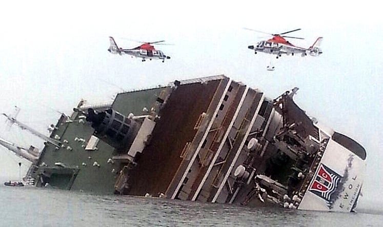 Rescue helicopters fly over a sinking South Korean passenger ferry. Photo: AP