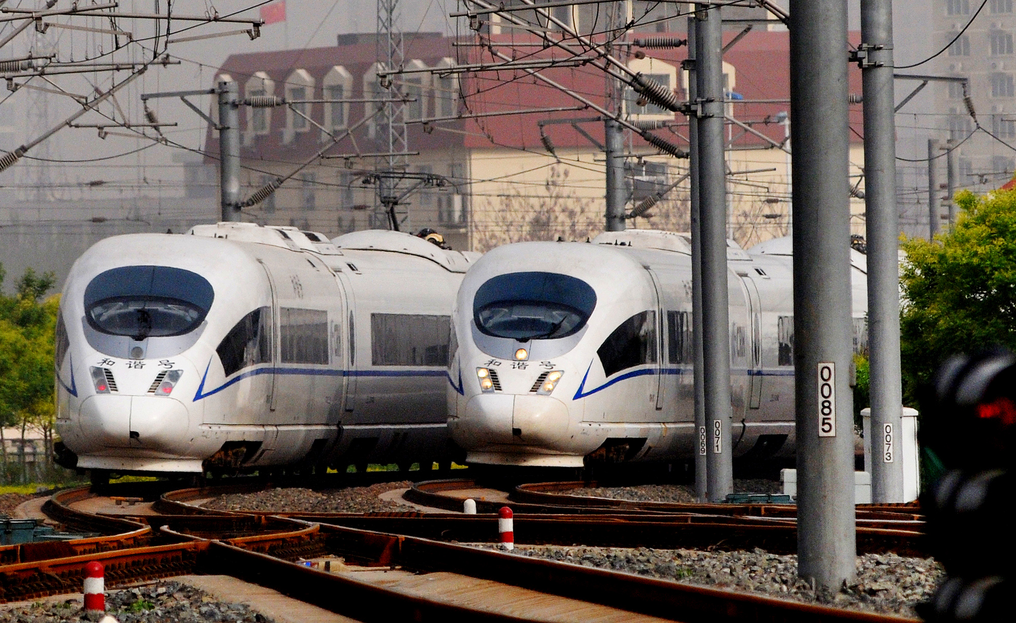 Photo taken on April 29, 2012 shows two CRH high-speed intercity trains, which travel between Beijing and Tianjin, at Tianjin Railway Station in north China's Tianjin Municipality. Photo: Xinhua