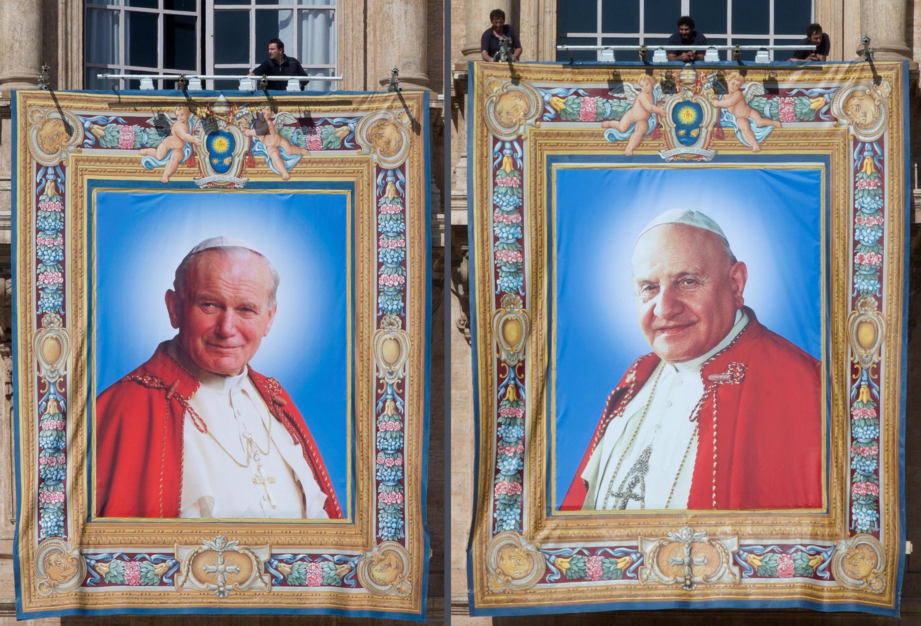 A composite photo shows the tapestry portraits of former Popes John Paul II, left, and John XXIII hanging in St Peter's Square, prior to Sunday's historic ceremony. Photo: EPA