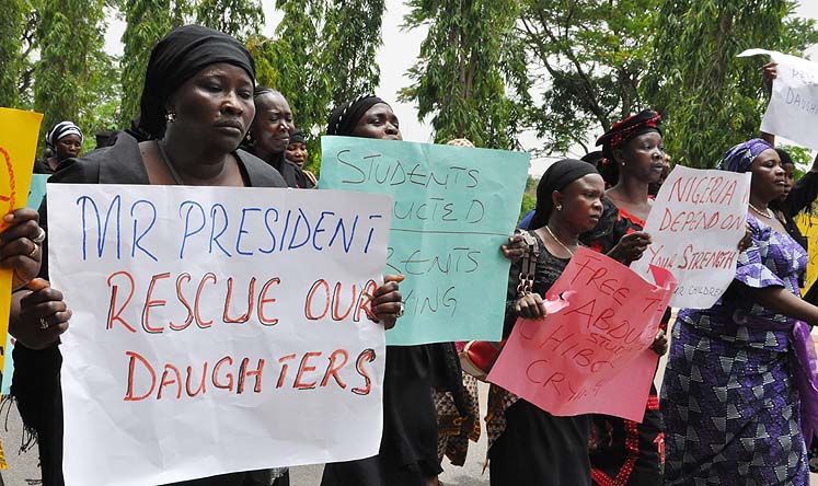 Relatives call on the president to help secure the release of the kidnapped school girls in Abuja, Nigeria on Tuesday. Photo: AP