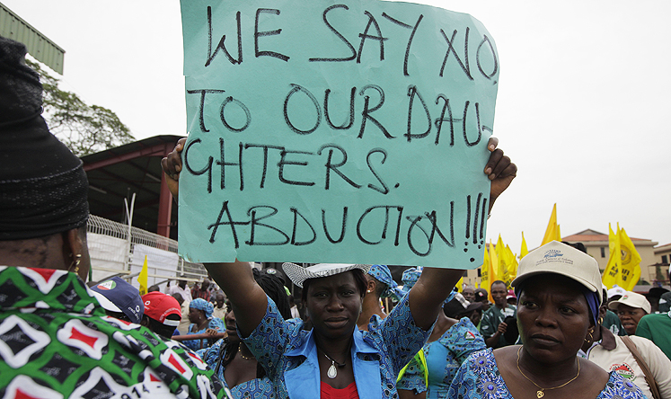 Women attend a demonstration calling on government to rescue the kidnapped schoolgirls during workers day celebration in Lagos. Photo: AP