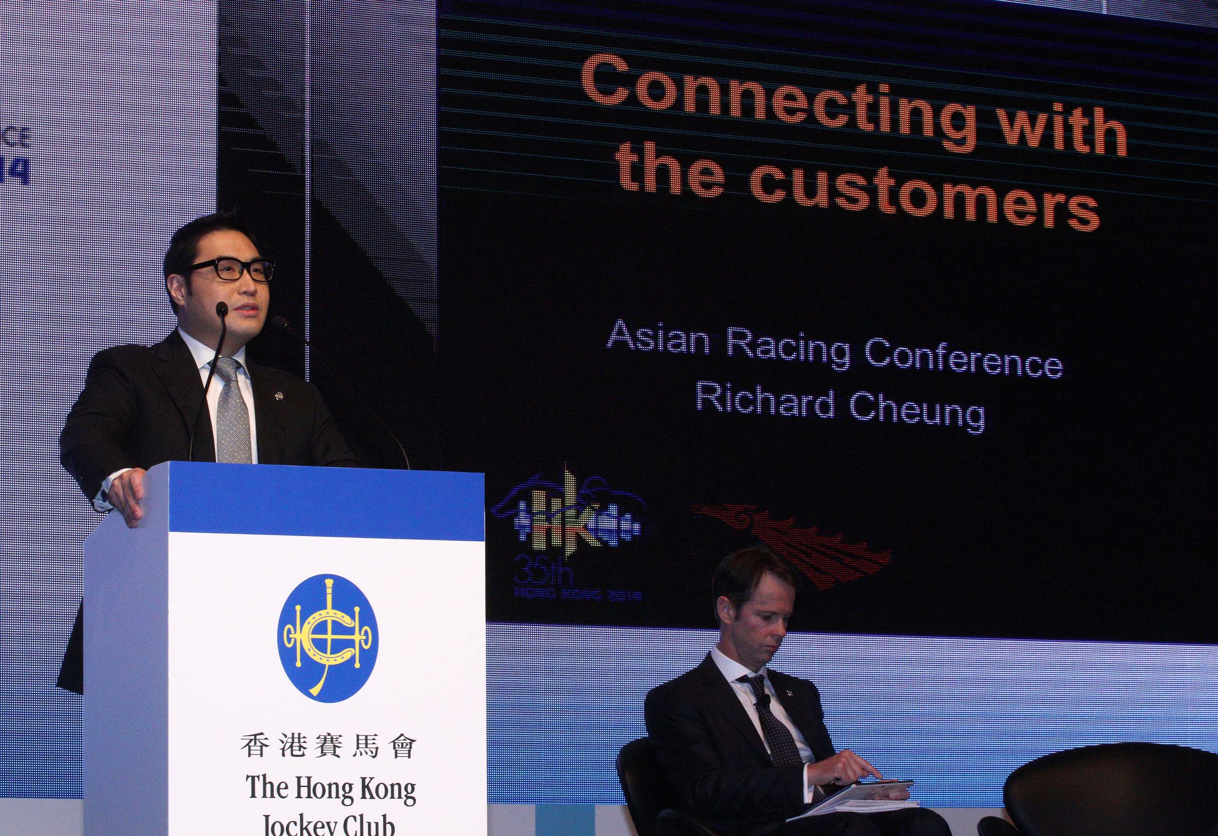 Richard Cheung, Executive Director, Customer and Marketing of the Hong Kong Jockey Club, presents his views to all attending delegates.