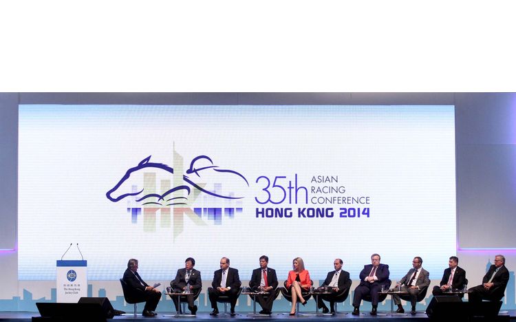 Several top racing executives from different countries are present on stage to discuss their experience and strategies in hosting world-class race events.