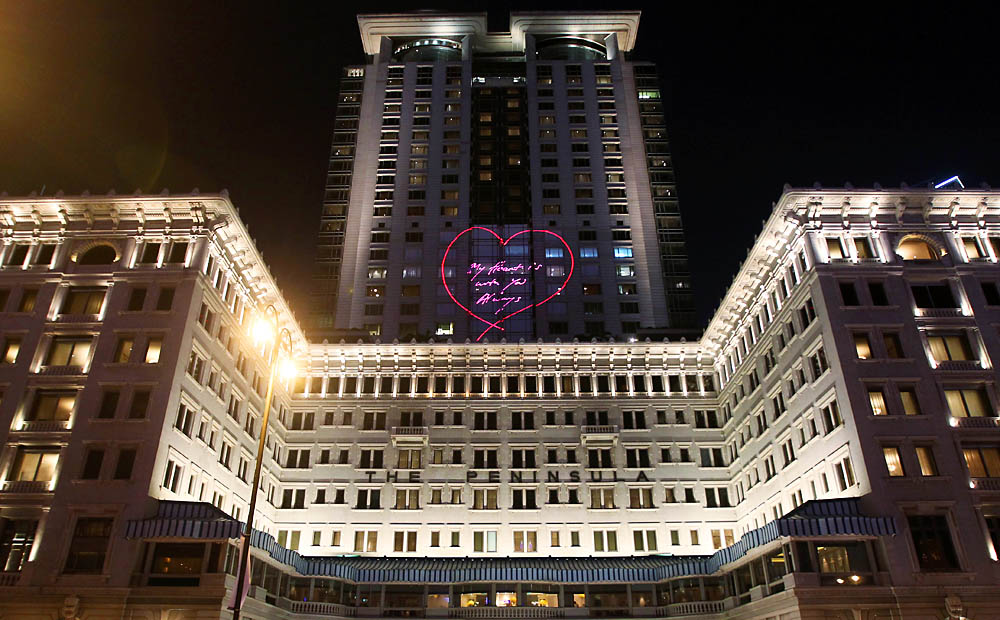 British artist Tracy Emin’s neon piece ‘My Heart Is With You Always’ is projected onto the Peninsula Hotel on May 15. Photo: Edward Wong