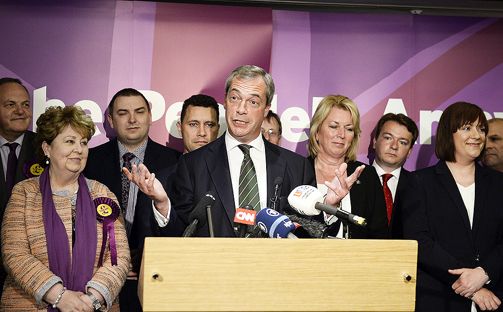 UKIP leader Nigel Farage stands with his newly elected MEPs in London. Photo: EPA