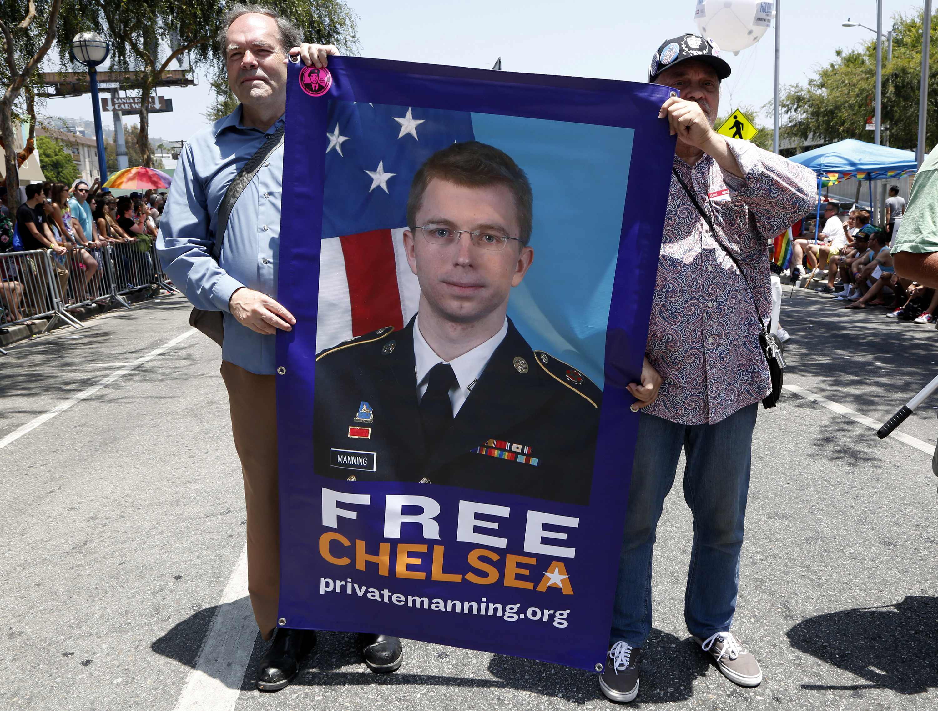 Men carry a free Chelsea Manning sign during the Los Angeles Pride parade in West Hollywood. Photo: Reuters