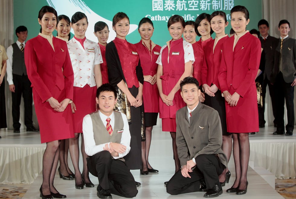 Flight attendants and ground crew of Cathay Pacific Airways present their new uniforms during a news conference at The Ritz Carlton Hong Kong in Kowloon. The new uniform is an evolution of the previous on designed by Eddie Lau in 1999 with new fabric introduced that providing more comfort and ease of movement. Photo: K.Y. Cheng