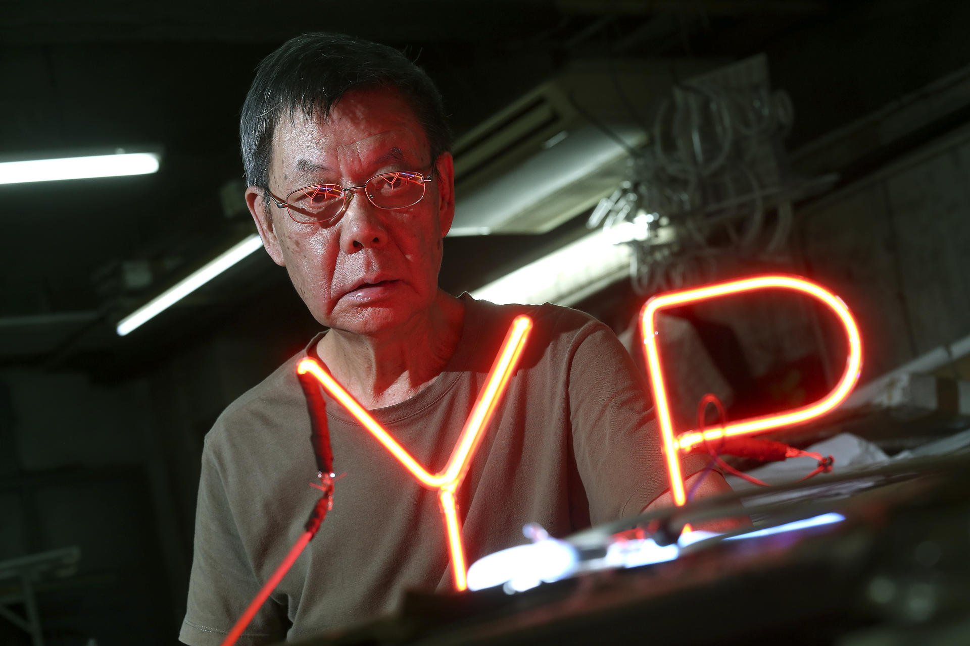 Lau Wan, one of the city's oldest neon craftsmen, fears the decline of neon reflects the decline of Hong Kong. Photo: K. Y. Cheng