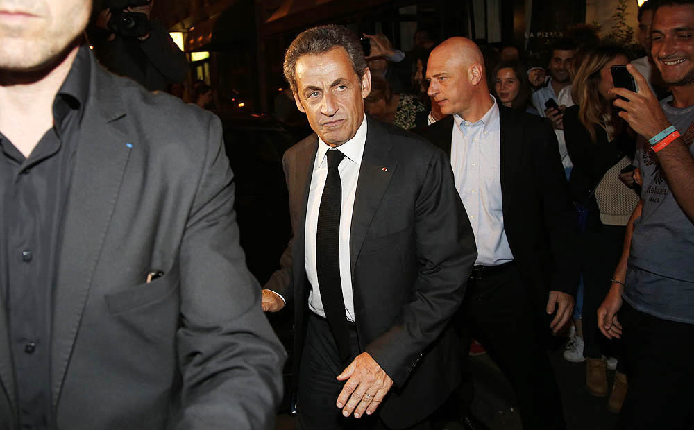 Former French President Nicolas Sarkozy leaves a restaurant in Paris on Wednesday. Photo: Reuters