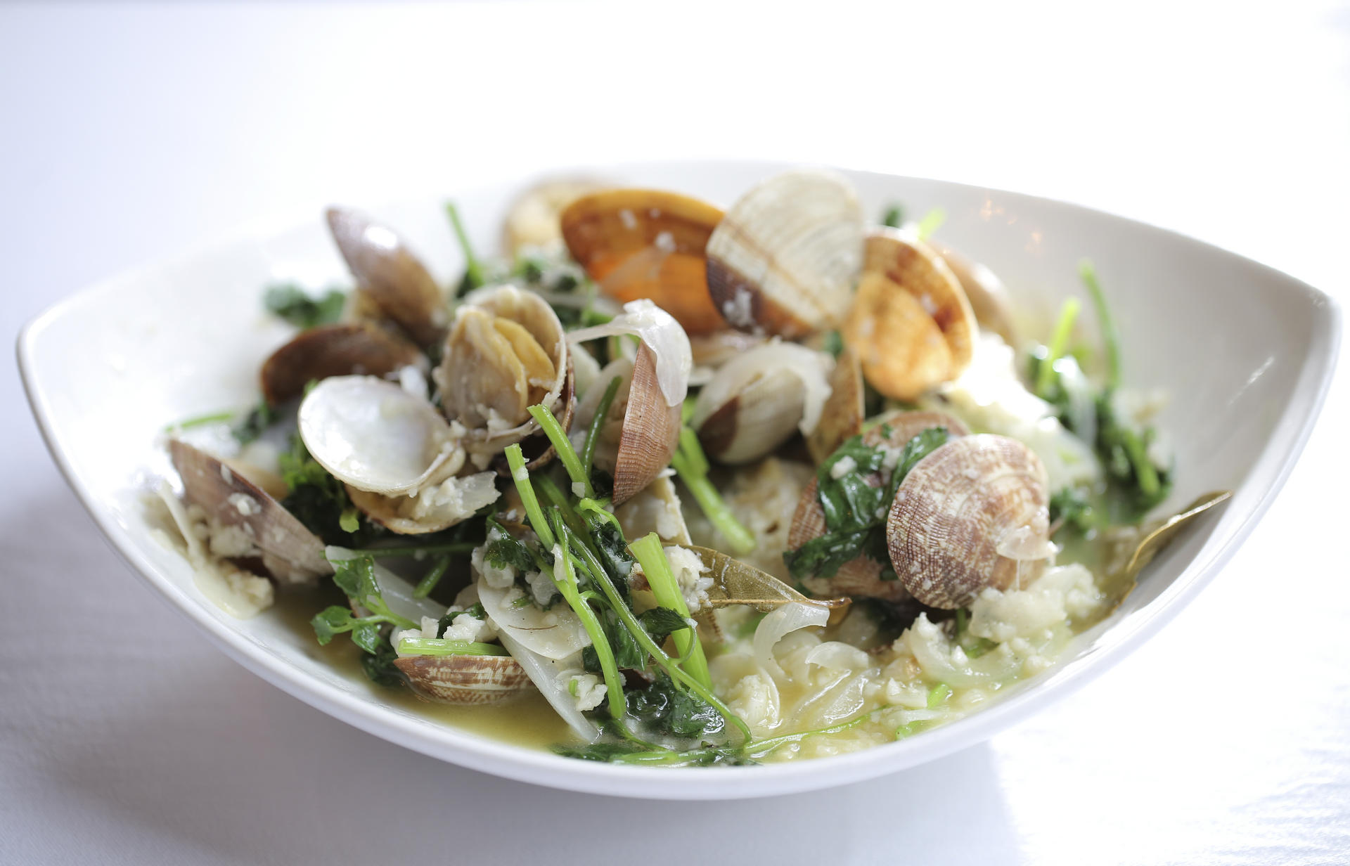 SHELL OUT: clams with white wine and lemon sauce at Albergue 1601. Photos:  Paul Yeung