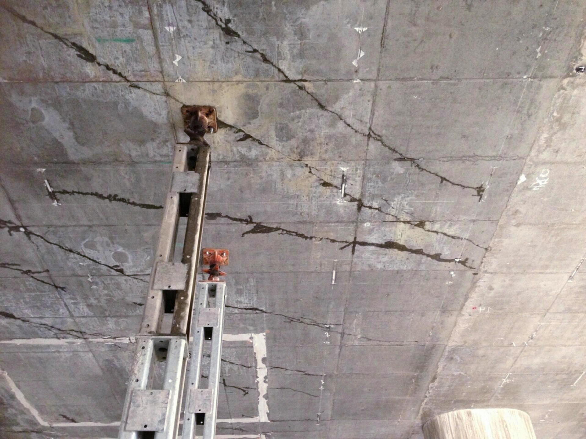 Cracks and supporting structures can clearly be seen on a ceiling at the West Kowloon rail terminus work site. Photo: SCMP  