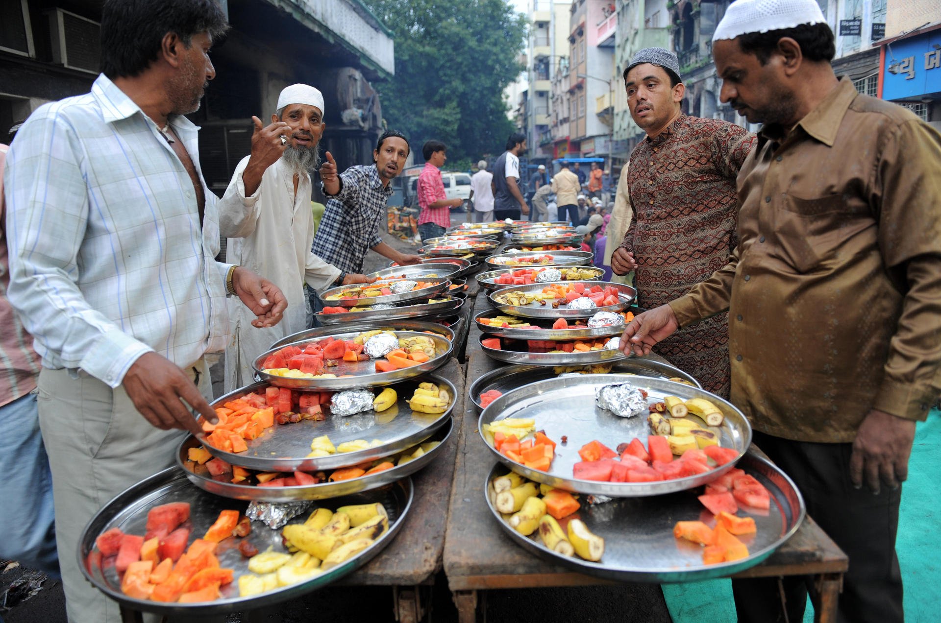 Muslim volunteers in Ahmedabad prepare food for a fast-breaking Iftar party during Ramadan. Photos: AFP