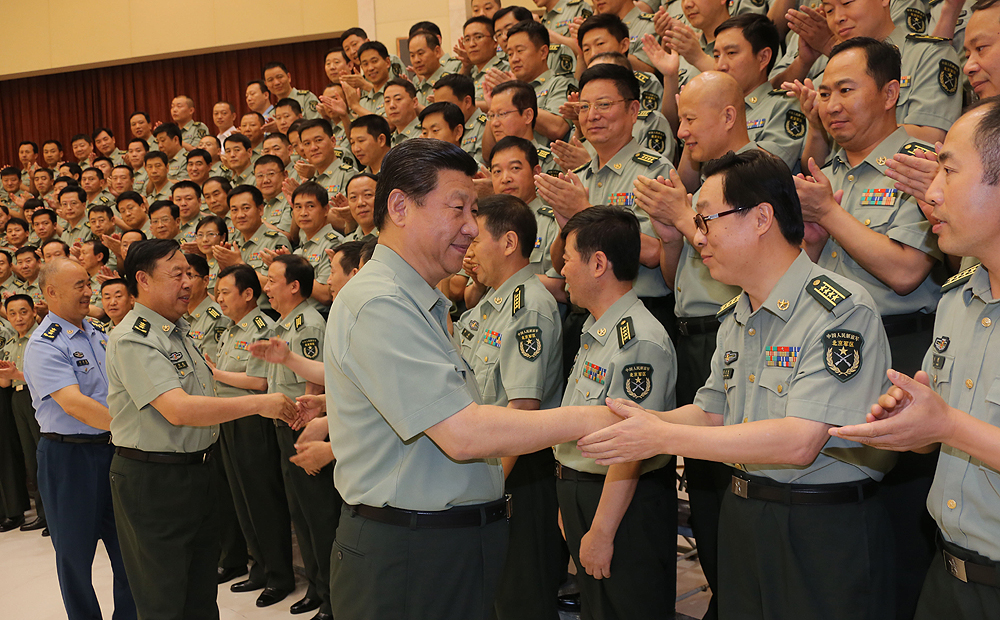 President Xi Jinping shakes hands with military cadre during a tour of the Beijing Military Area Command in July, 2013. Photo: Xinhua