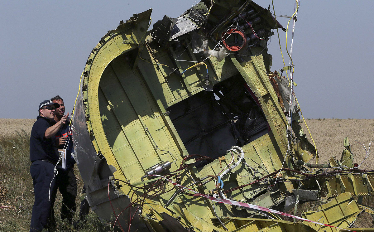 International experts inspect wreckage at the crash site of the downed Malaysia Airlines flight MH17 near Grabove in the Donetsk region of eastern Ukraine. Photo: Reuters 