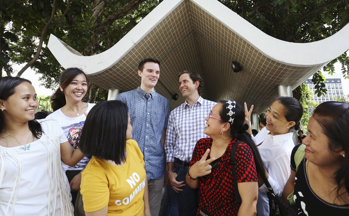 Scott Stiles (left) and David Bishop (right), co-founders of the Fair Employment Agency, with domestic helpers. Photos: Nora Tam; Sam Tsang; Thomas Yau