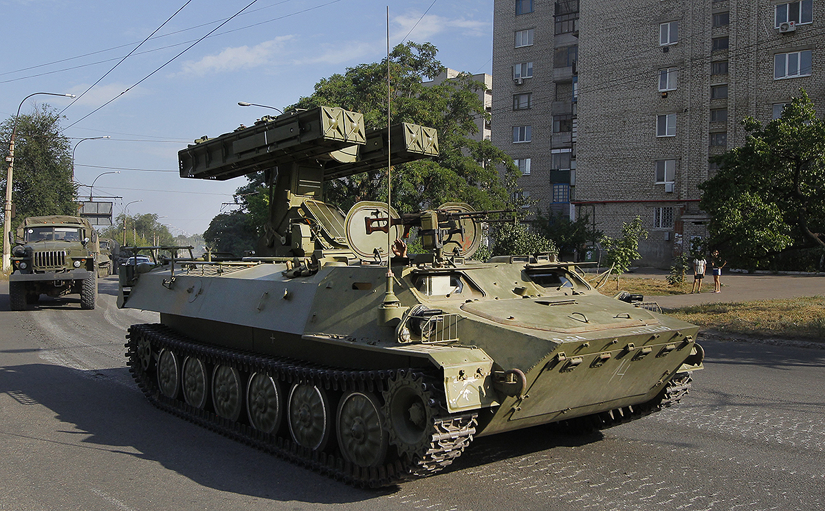 A missile launcher used by pro-Russian rebel forces drives through the town of Krasnodon, eastern Ukraine, on Sunday. Photo: AP 