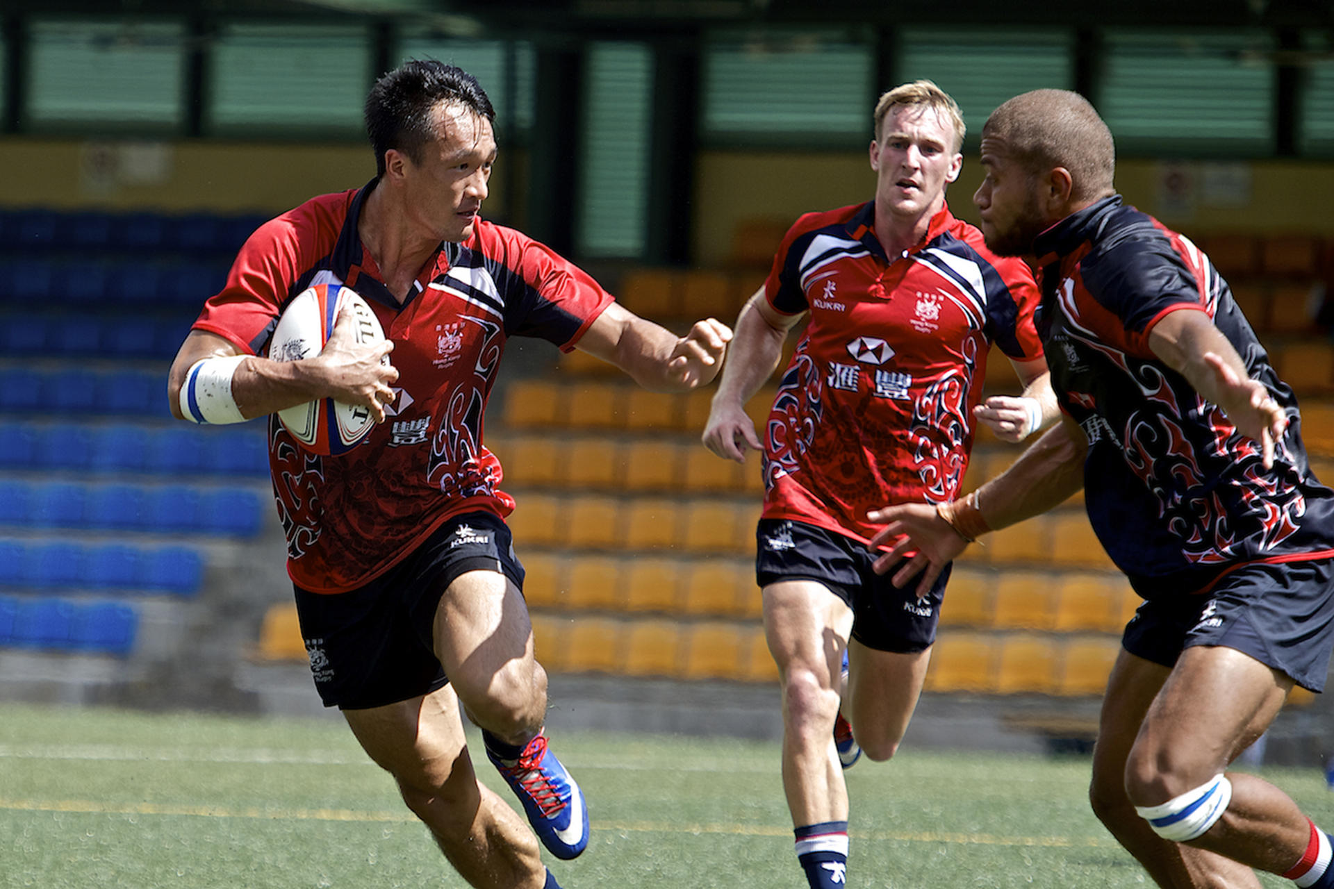 Salom Yiu Kam-shing is chased by Tomasi Lawa (right) and Alex McQueen in training at the Football Club. Photo: SCMP Pictures