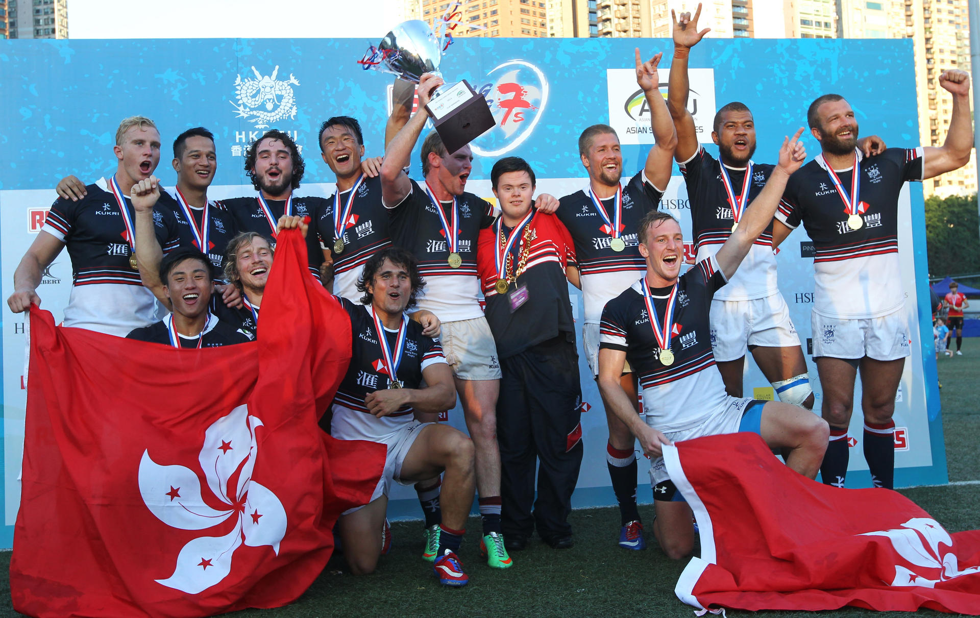 Hong Kong celebrate their victory in the Cup competition after easily defeating rivals South Korea 40-0 in the final at Football Club. Photos: Felix Wong/SCMP
