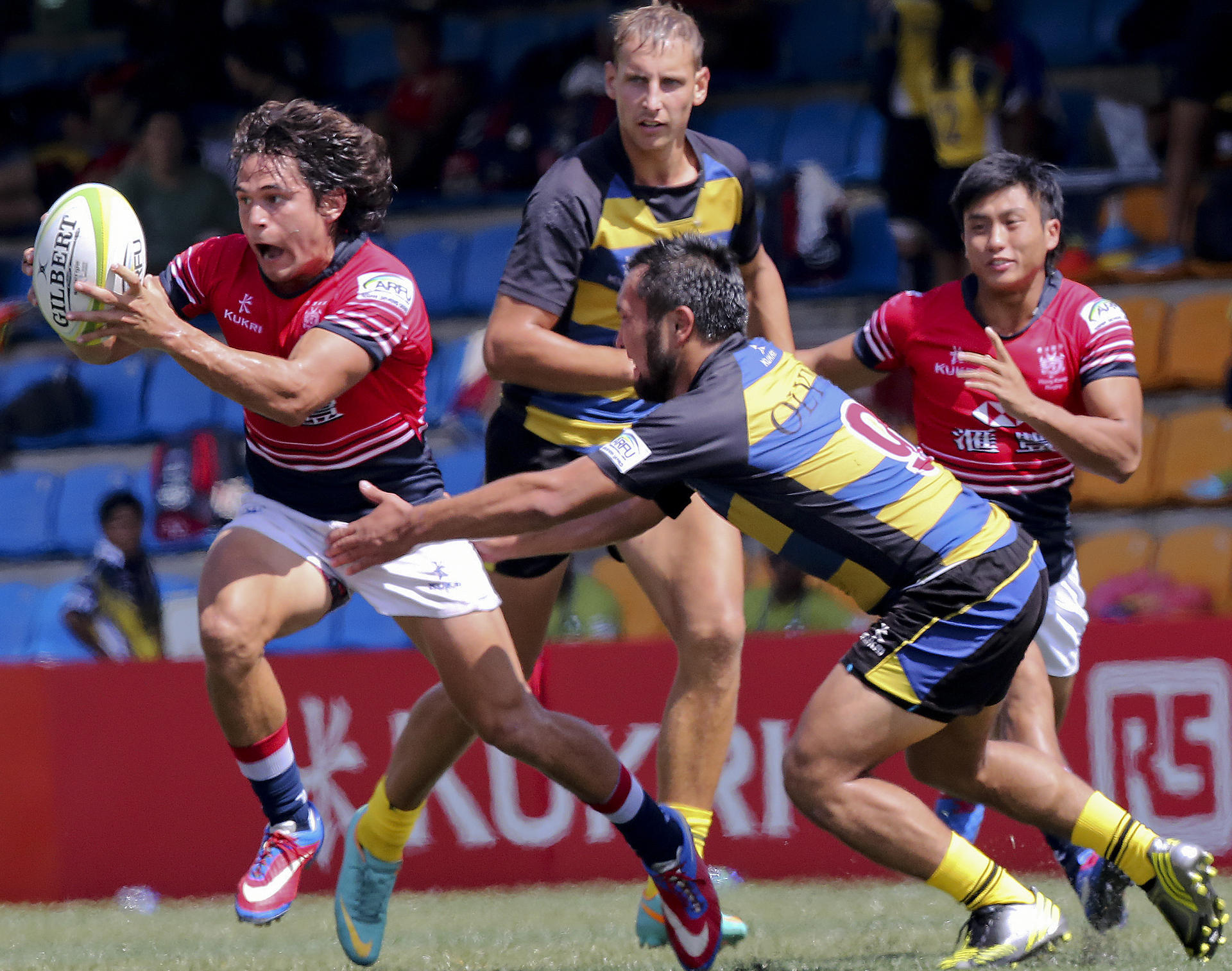 Rowan Varty eludes a Kazakhstan player during Hong Kong's 38-5 victory at HKFC on Saturday. Hong Kong also beat the Philippines 24-0. Photos: Felix Wong