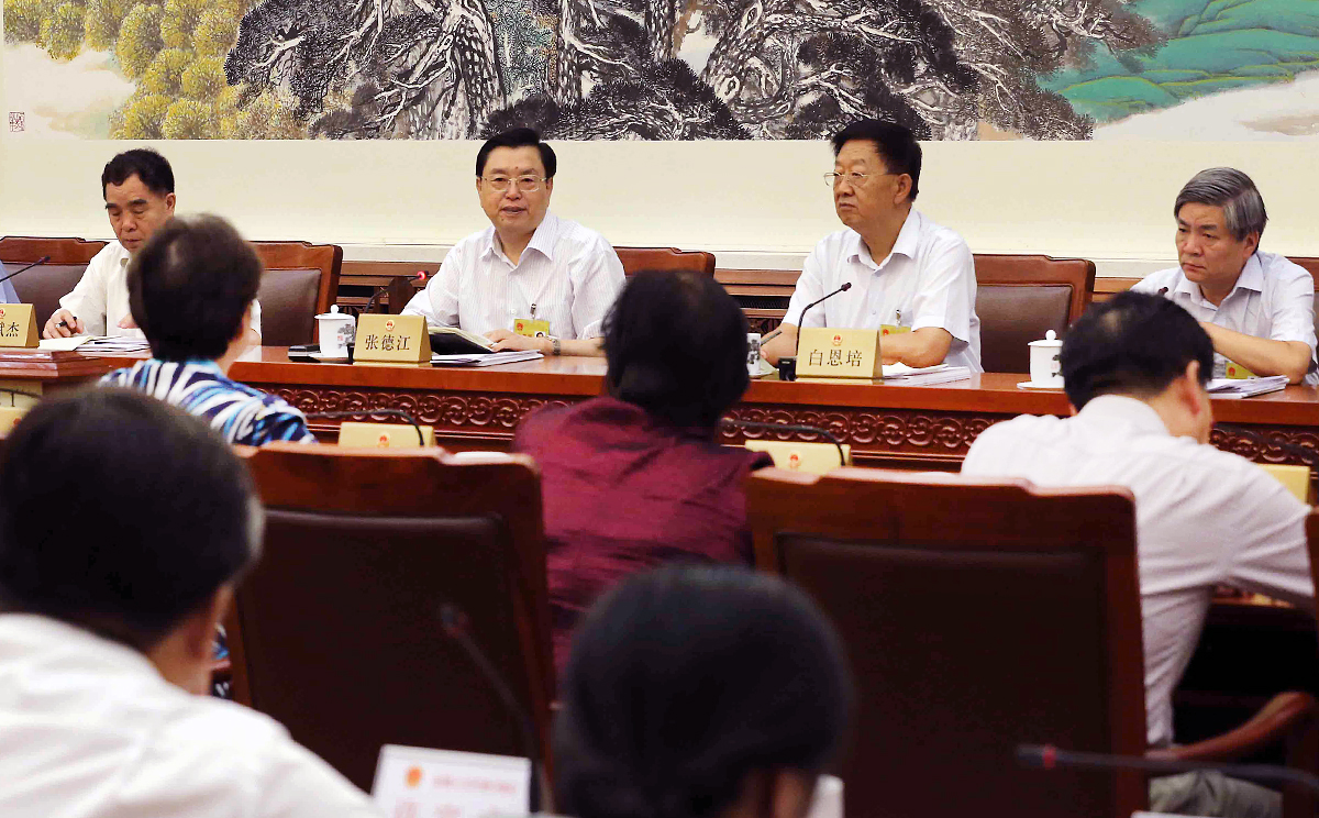 Zhang Dejiang (second left), chairman of the Standing Committee of China's National People's Congress (NPC), attends the 10th meeting of the 12th NPC Standing Committee in Beijing. <br> A draft resolution is expected to be table at the Standing Committee's plenary session this afternoon. Photo: Xinhua