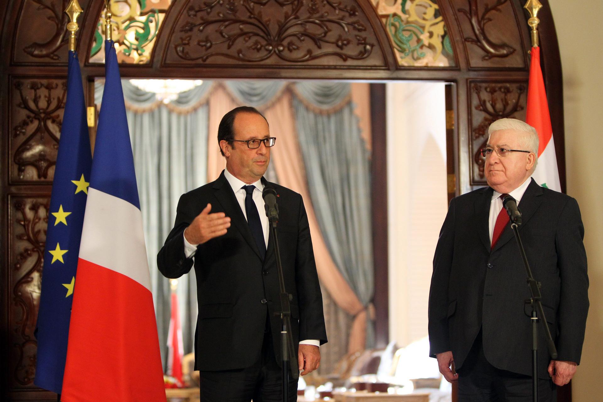 Francois Hollande (left) with his Iraqi counterpart Fouad Massoum in Baghdad yesterday. Photo: EPA