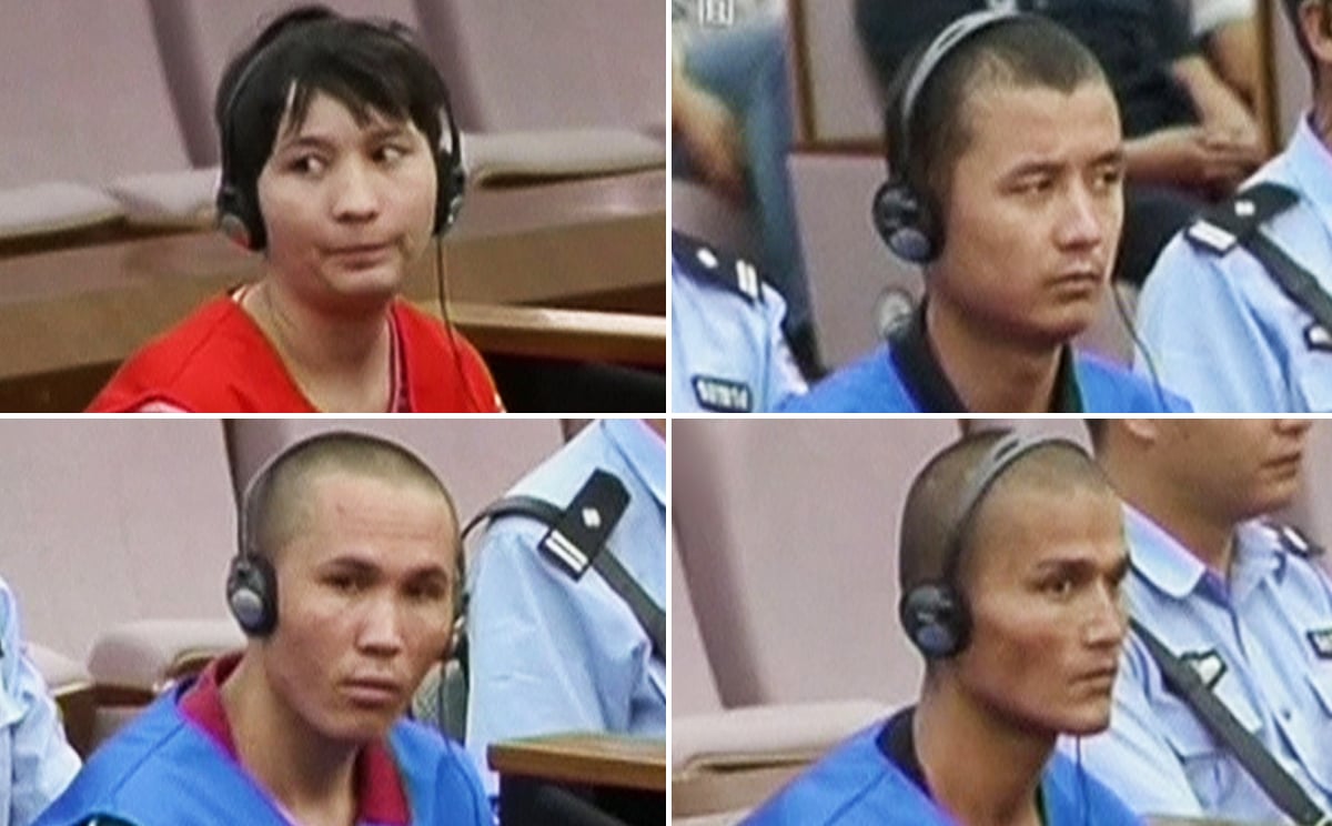 The four defendants accused of participating in an attack at Kunming train station went on trial on Friday. Photos: Reuters