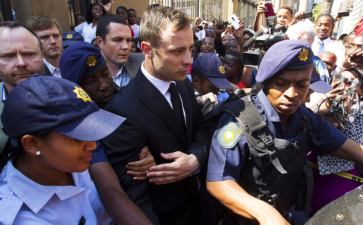Oscar Pistorius leaves court in Pretoria after being found guilty of negligently killing his girlfriend. Sentencing is next month. Photo: Reuters