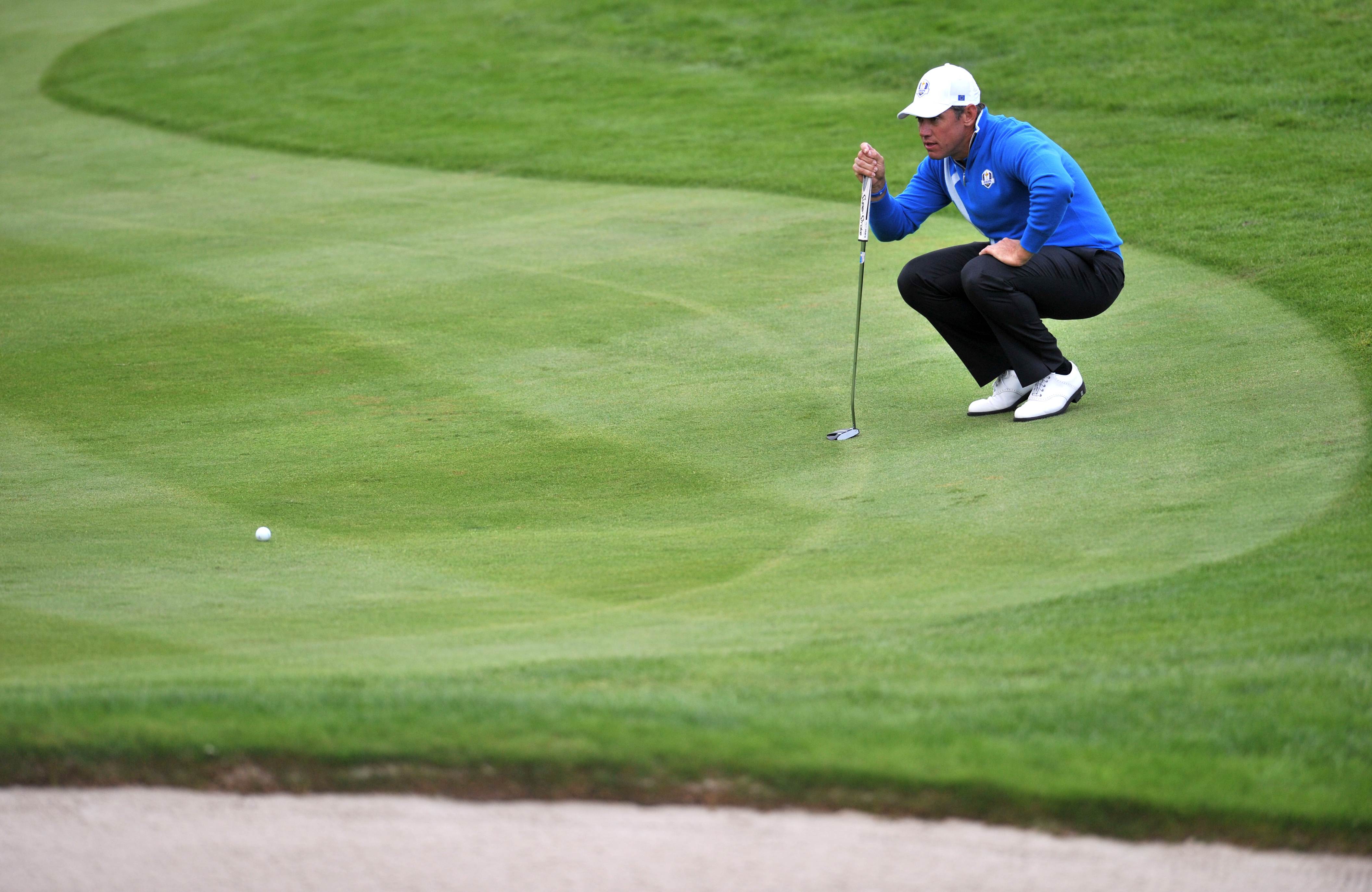 Team Europe's Lee Westwood lines up his putt on the 16th green during the foursome afternoon match at Gleneagles. Photo: AFP 