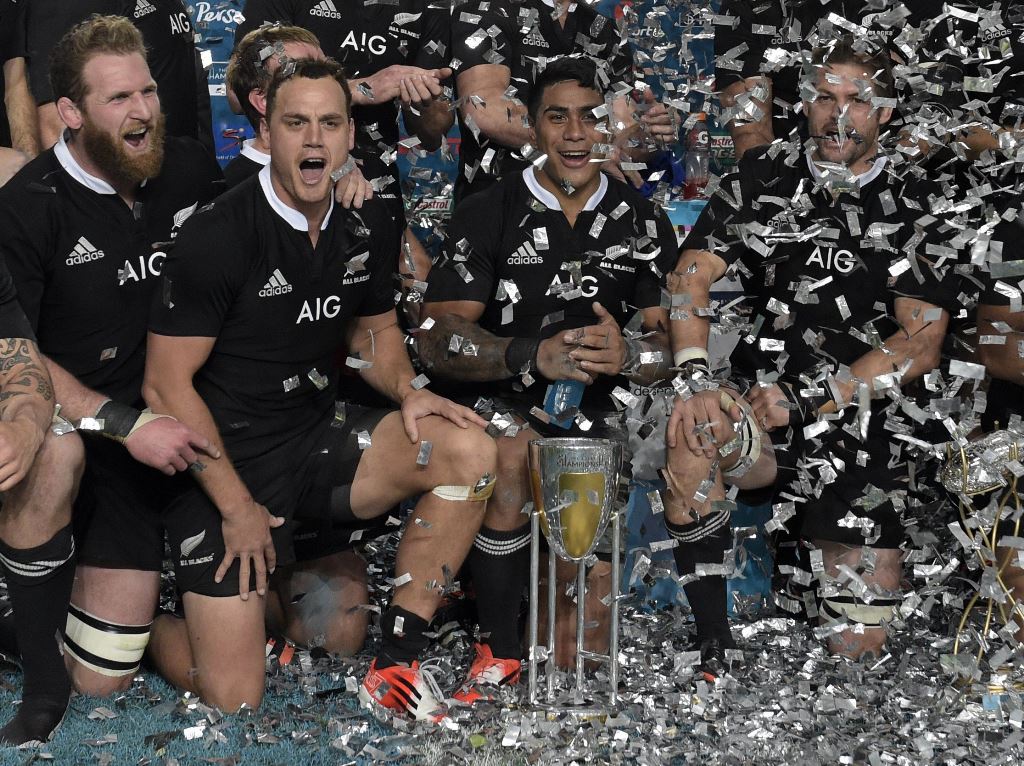 The All Blacks celebrate after defeating Los Pumas 34-13 on Saturday to win the 2014 Rugby Championship. Photo: AFP