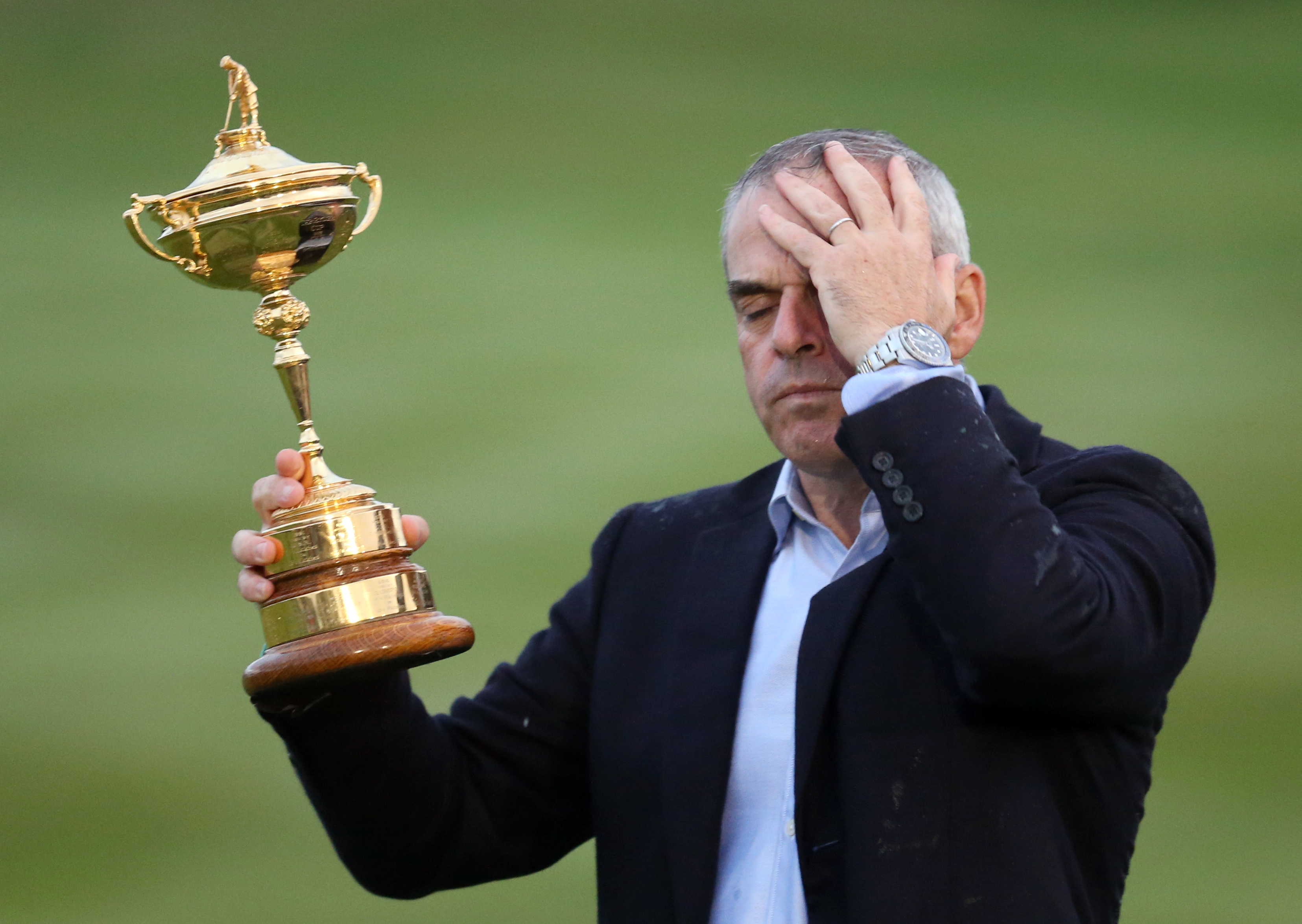 An emotional Paul McGinley  holds the Ryder Cup. Photo: AP
