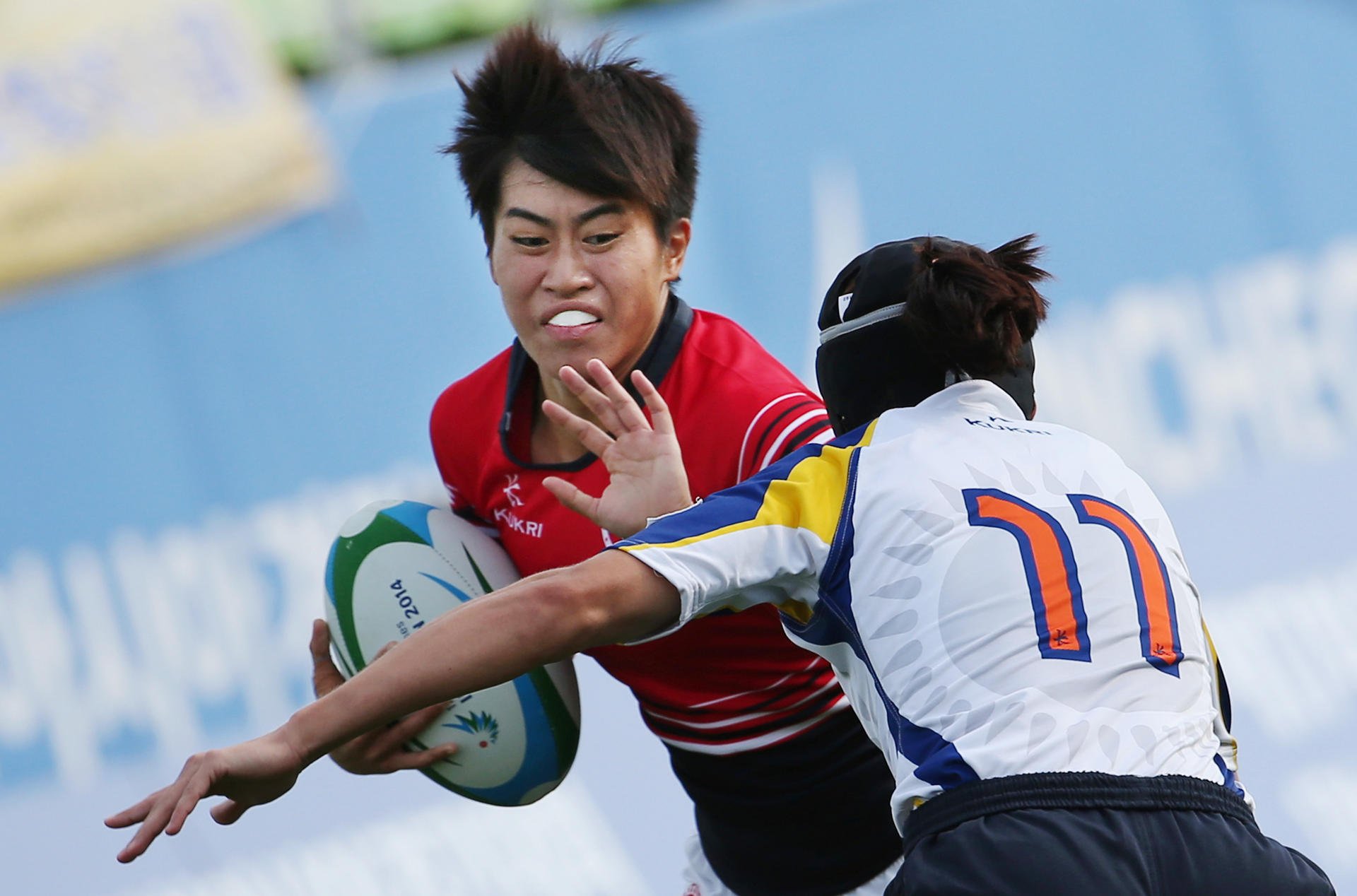 Hong Kong's Aggie Poon Pak-yan fends off a tackle against Kazakhstan. Photos: Nora Tam