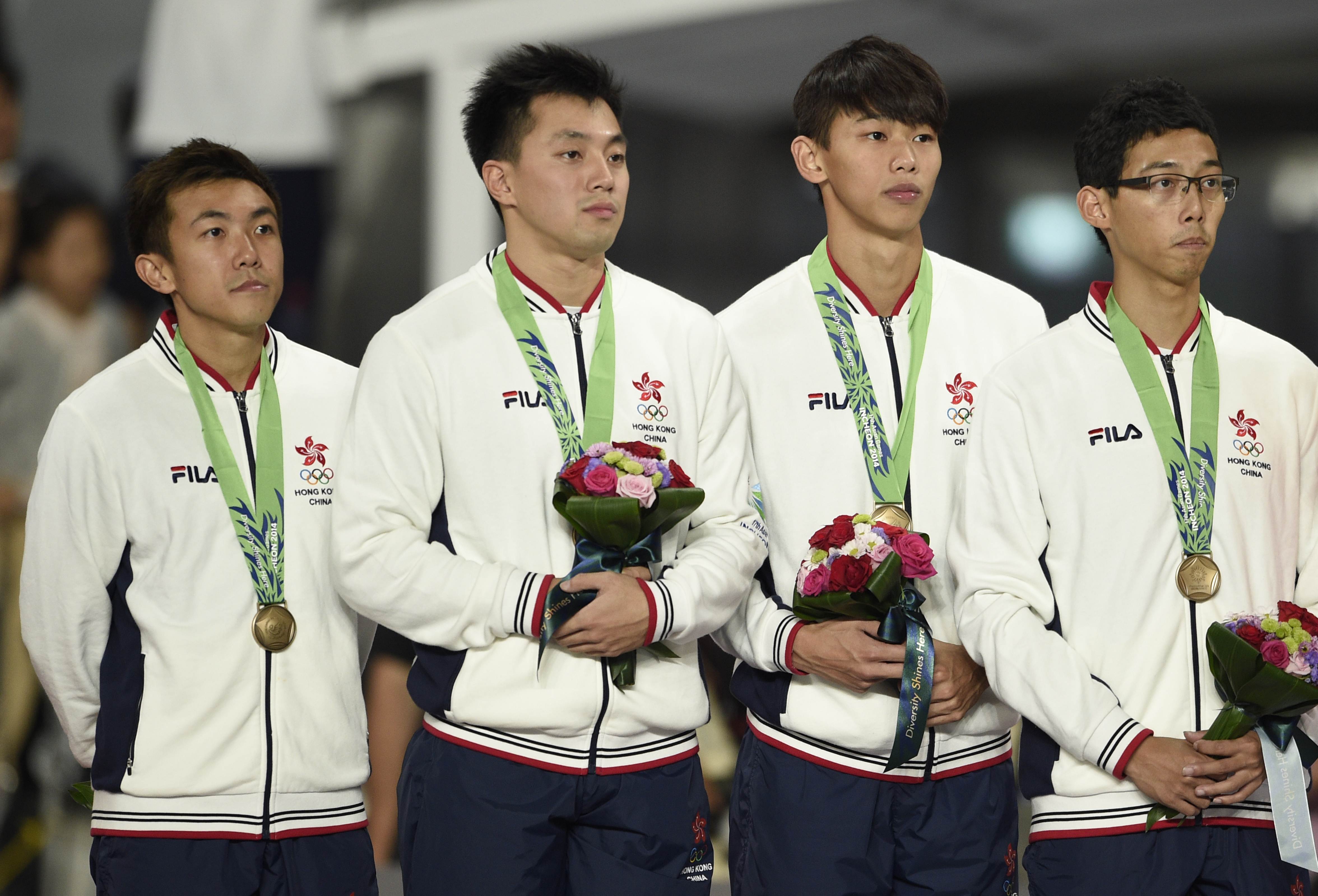 Hong Kong (L-R) bronze medallists Tsui Chi-ho,  Ng Ka-fung, So Chun-hong and Tang Yik-chun  pose with their medals. Photo: AFP