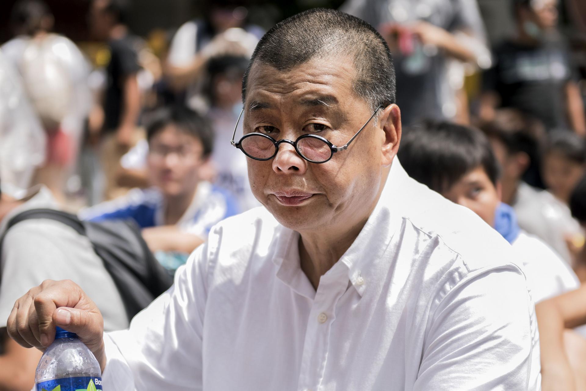 Aides to the city's last governor Chris Patten allegedly offered Next Media chairman Jimmy Lai Chee-ying (pictured) a British passport before the handover.