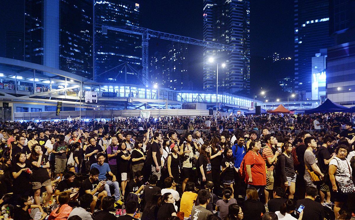 Thousands of pro-democracy protesters gather near the government headquarters in Hong Kong on Saturday. Photo: AP