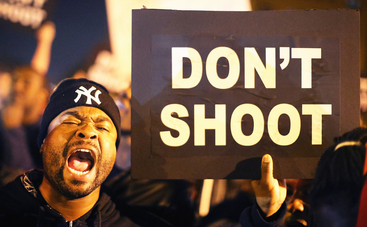 Protesters cheer after blocking an intersection after the vigil in St Louis on Thursday. Photo: AFP