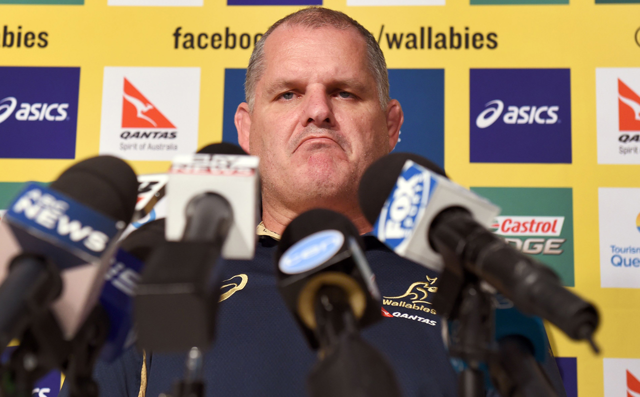 Stony-faced Wallabies coach Ewen McKenzie faces the media Friday and rejects rumours about his relationship with the team's business manager, Di Patston. Photo: AFP