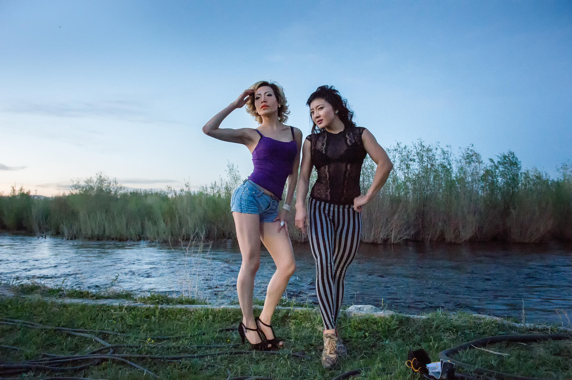 Women pose at River Beach, a resort on the banks of the Tuul river. Located on the outskirts of Ulan Bator, River Beach is a popular hangout for young Mongolians.