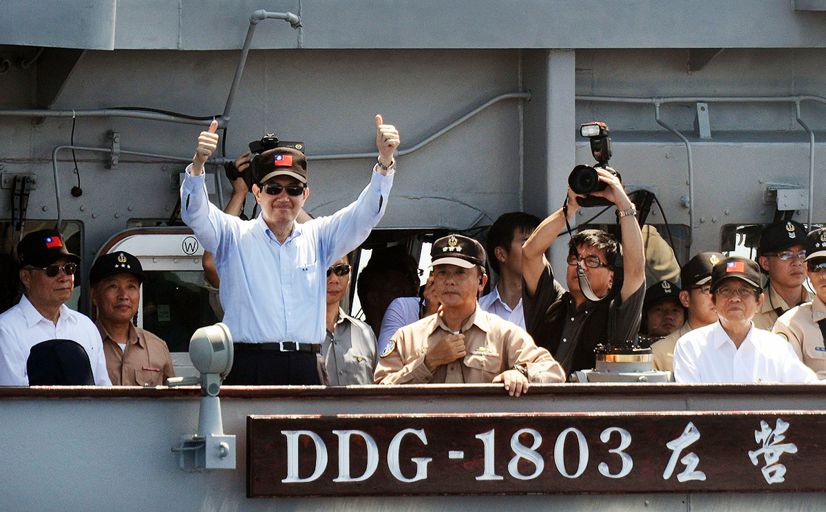 Taiwan President Ma Ying-jeou gestures from a US-made naval destroyer during a drill at sea in September. Photo: AFP