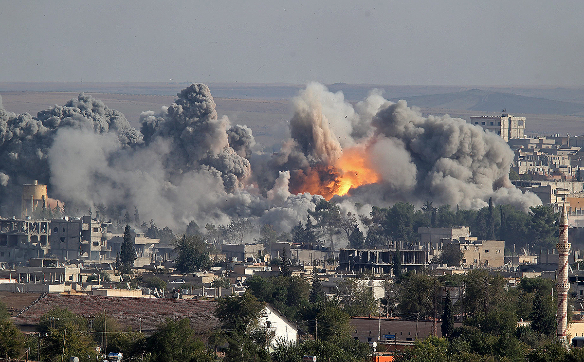 Smoke rises after an US-led coalition airstrike on Kobane, Syria on Saturday. Photo: EPA