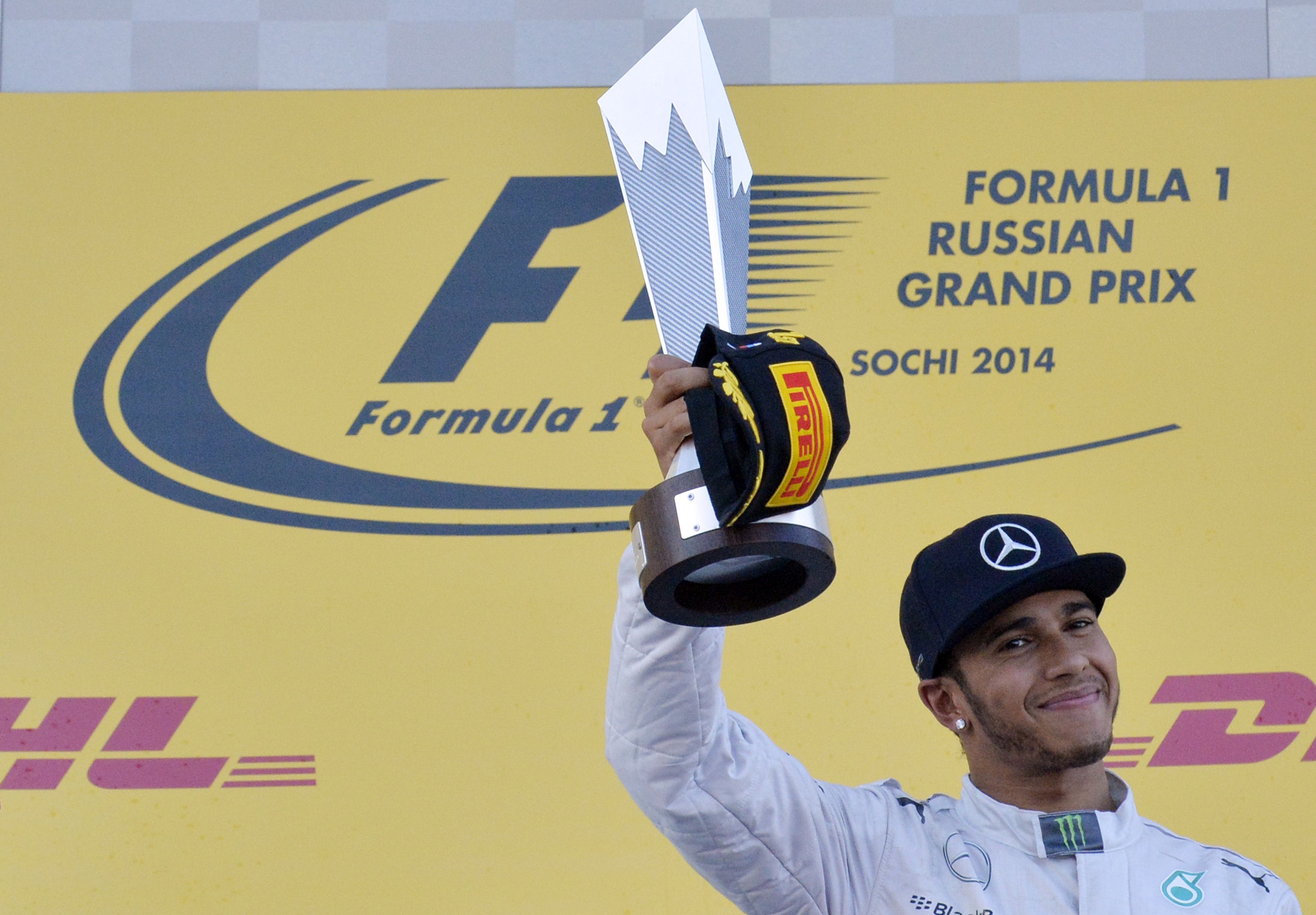 Mercedes' Lewis Hamilton raises his trophy after winning the inaugural Russian Formula 1 Grand Prix at the Sochi Autodrom. Photo: AFP