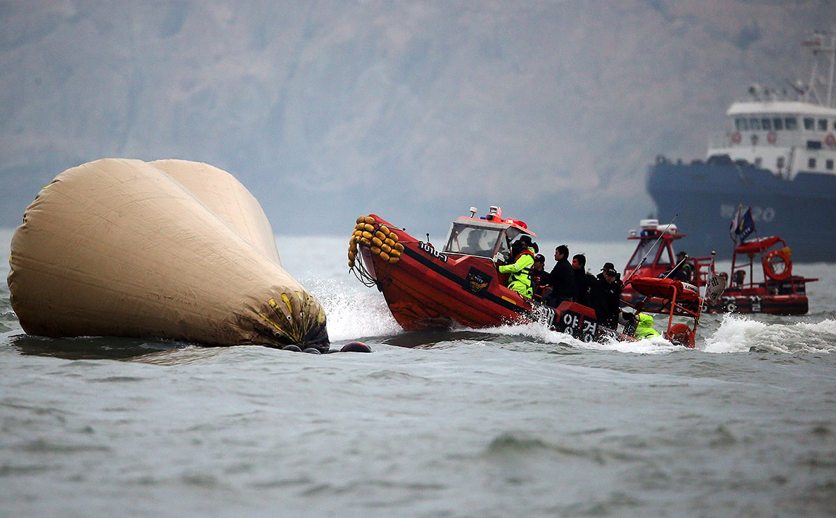 Rescuers search for victims in the first days after the sinking of the ferry. Photo: AP