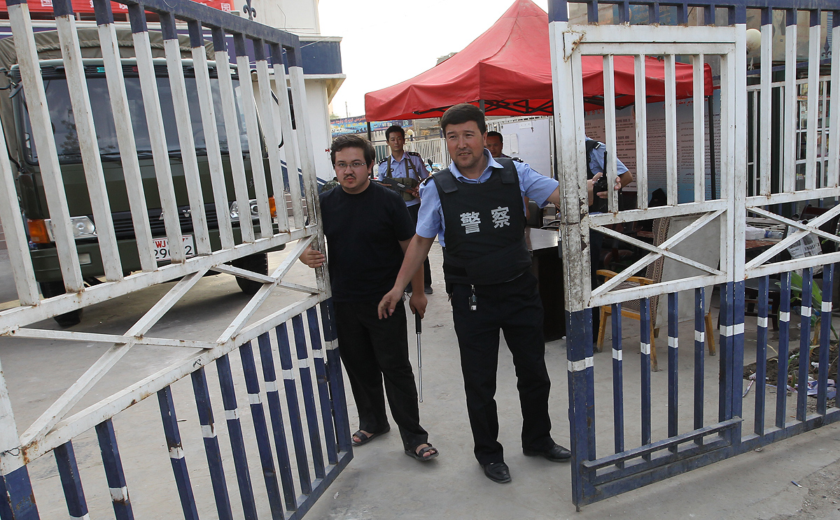 Armed guards at the gates of the police station in the Xinjiang city of Hotan, where mayor Adil Nurmemet is under investigation for graft. Photo: SCMP Pictures