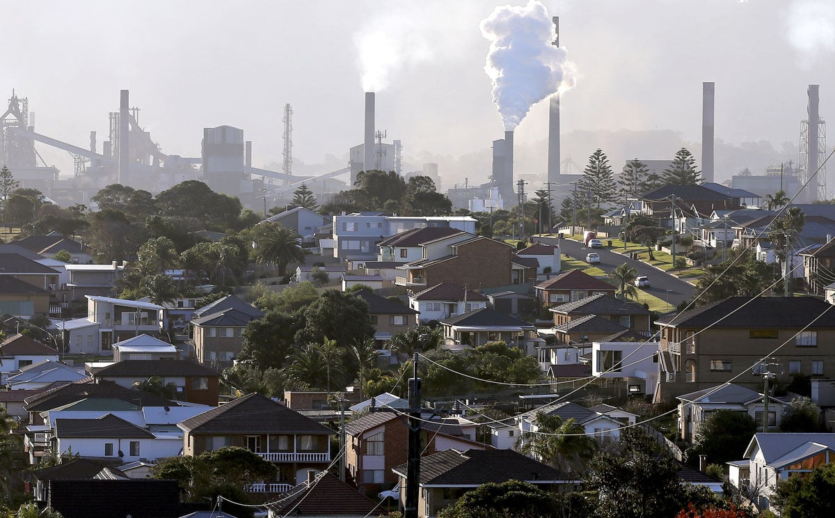 Smoke billows out of a chiming chimney stack of a steel works factories in Port Kembla 86 kilometers south of Sydney in this file picture from May. Photo: AP