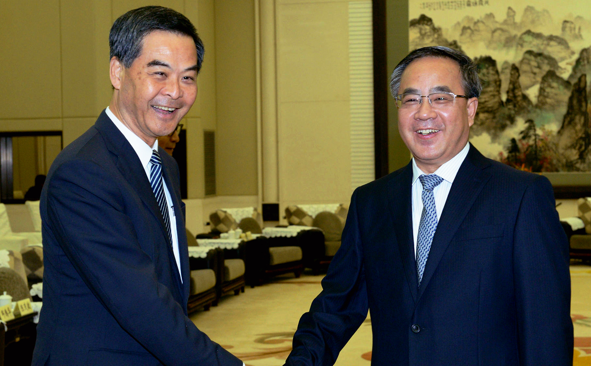 Leung with Guangdong Party chief Hu Chunhua. Photo: SCMP