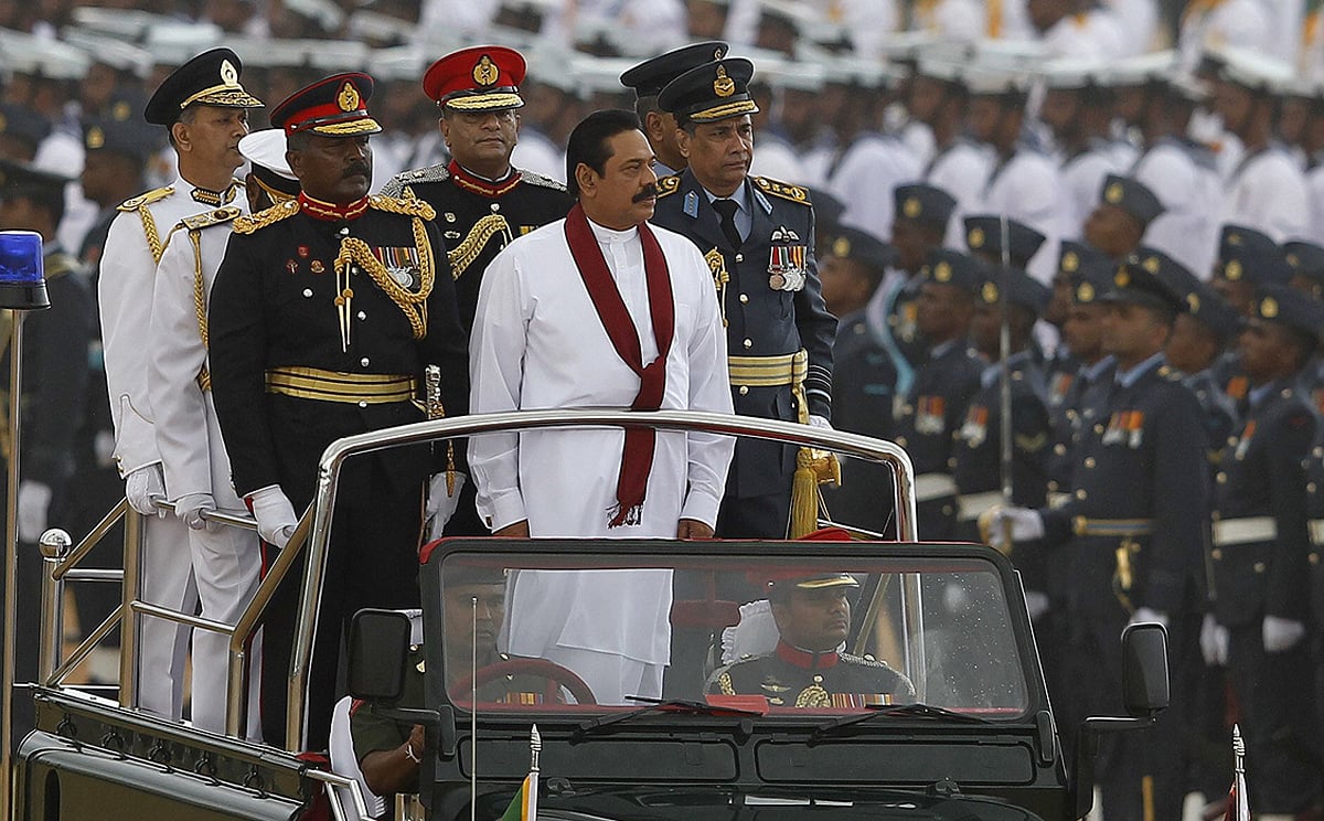 Sri Lanka's President Mahinda Rajapaksa (centre) inspects a military parade in Colombo. Photo: Reuters