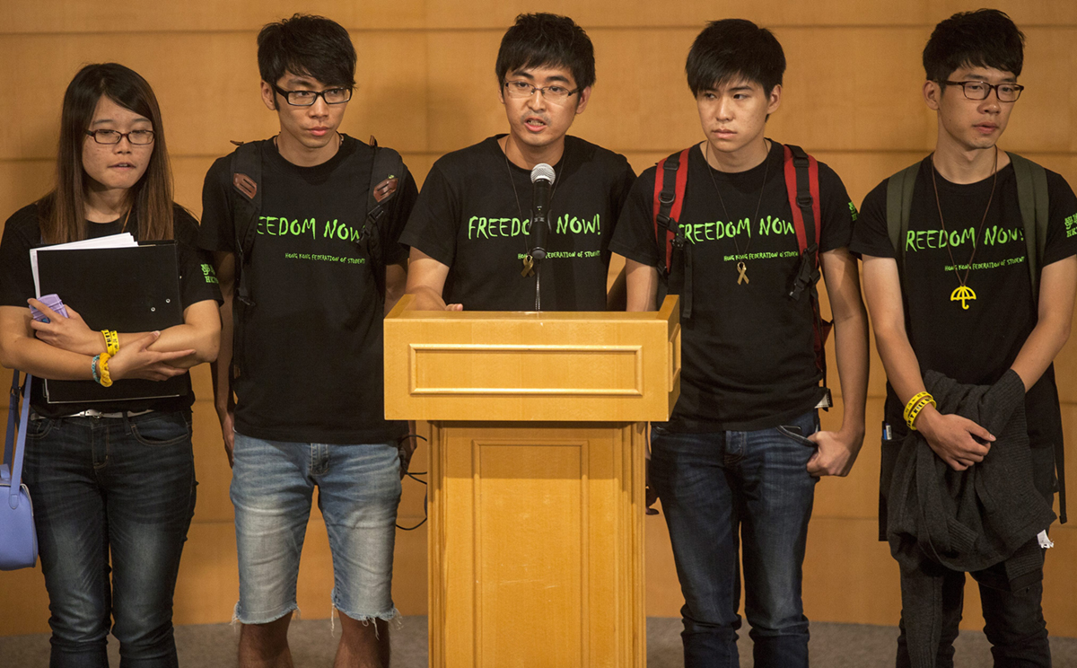Student leaders speak at a press briefing after a meeting with government officials to attempt to resolve the pro-democracy road occupations and resulting political crisis. Photo: EPA