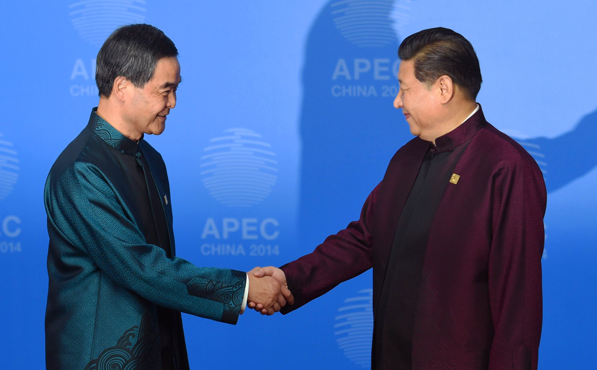 Hong Kong's Chief Executive Leung Chun-ying (left) is welcomed by Chinese President Xi Jinping. Photo: AFP