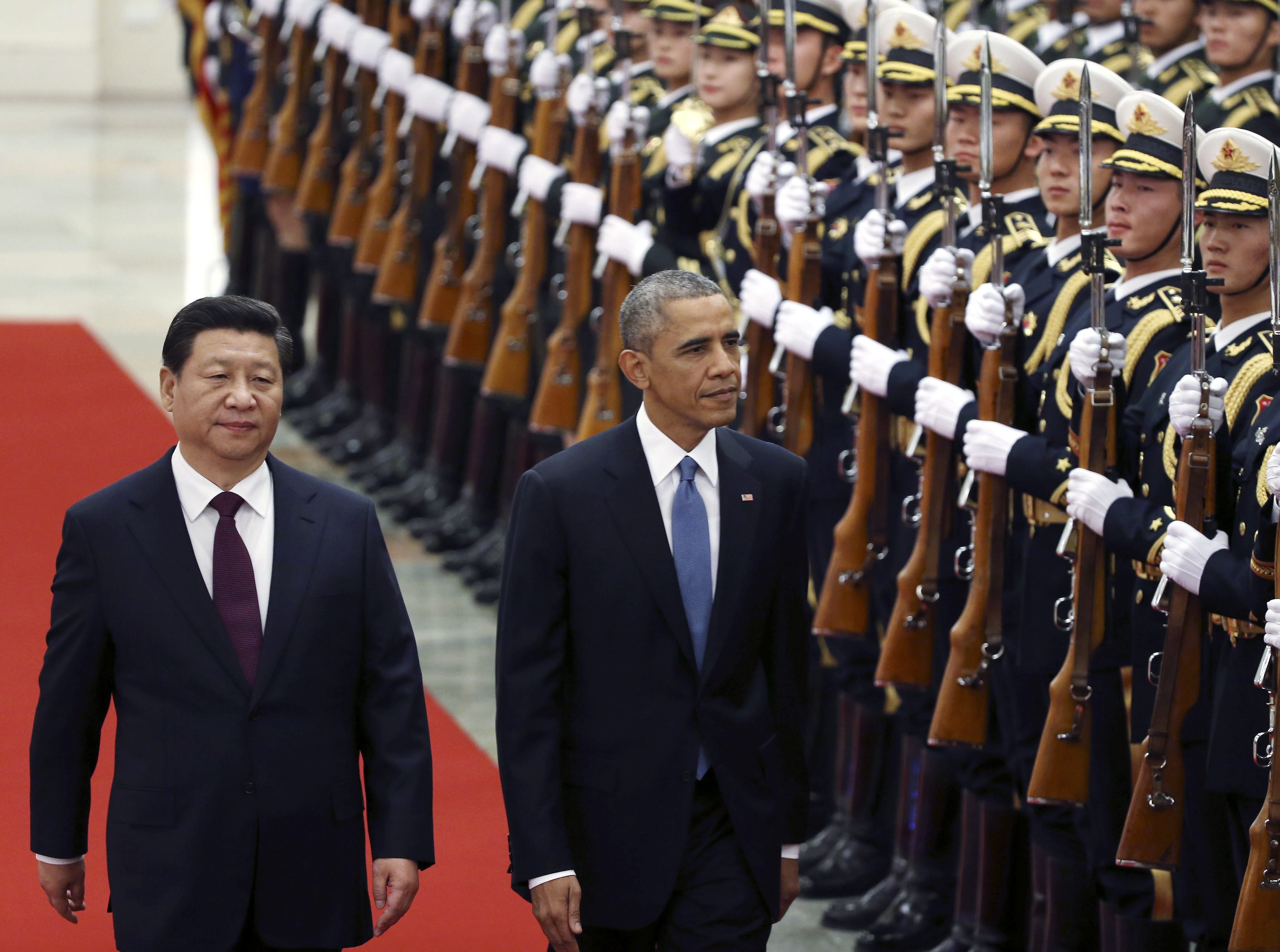 Chinese President Xi Jinping (left) and US President Barack Obama review honour guards during a welcoming ceremony at the Great Hall of the People  in Beijing. Photo: EPA
