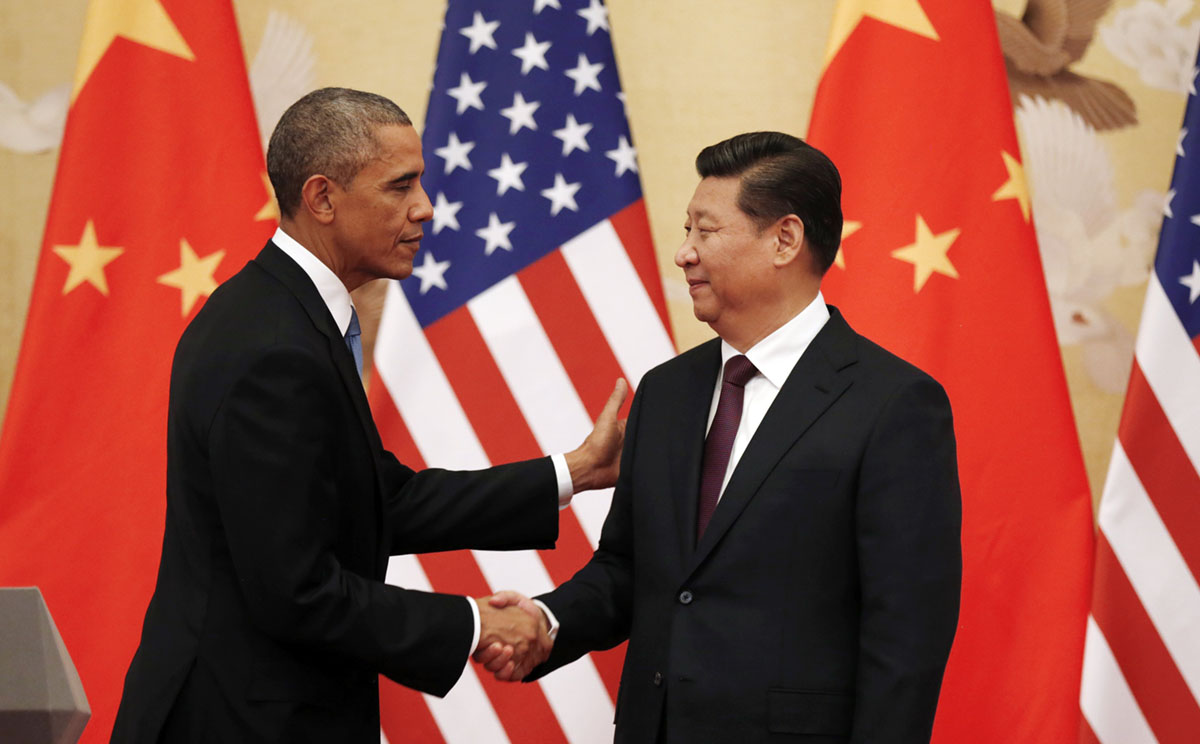 US President Barack Obama and Chinese President Xi Jinping shake hands at the end of their news conference in the Great Hall of the People in Beijing. Photo: Reuters